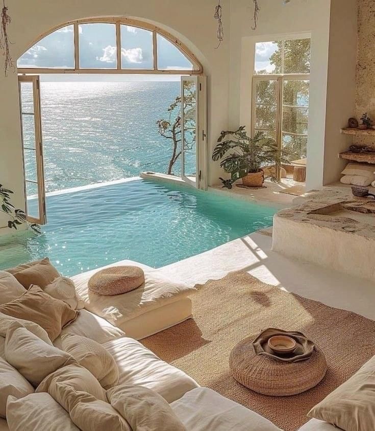 A sunlit Blanche interior with a private pool and sea view